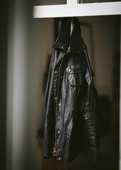 Barbour waxed jacket hanging to dry