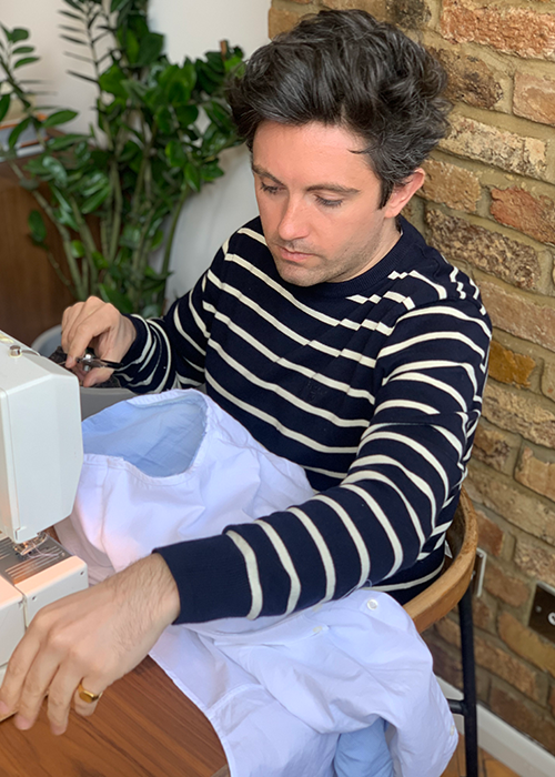 Daniel W. Fletcher wears the Barbour Bight Striped Sweater in Navy while he cuts and sews his new Barbour Shirt